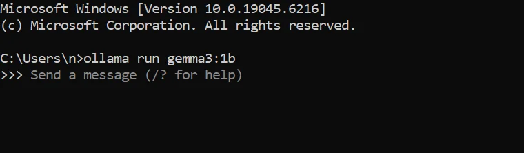 Screenshot of a Windows Command Prompt showing ollama run gemma3:1b executed successfully, with the prompt displaying “Send a message (/? for help)” indicating the model is ready for input.