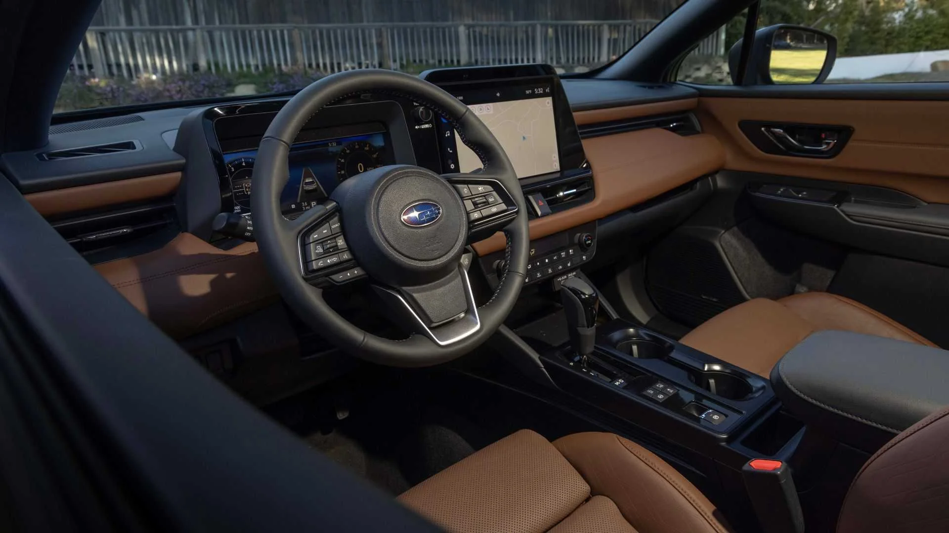 Shot inside the cabin of a 2026 Subaru Outback showing the steering wheel, dashboard, and interior.