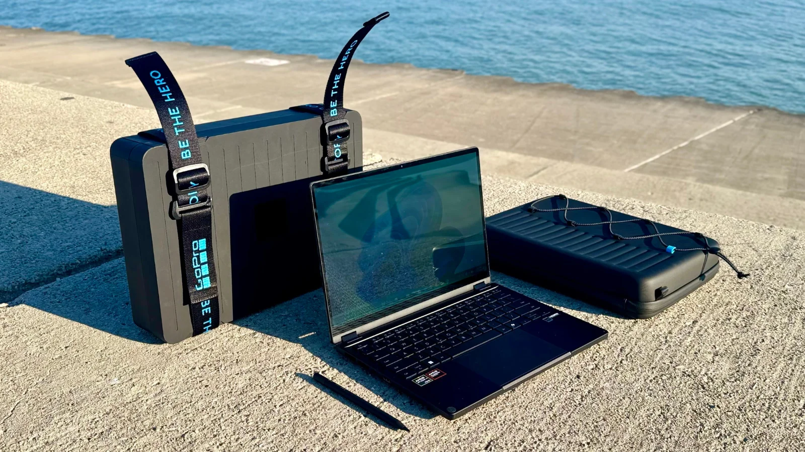 the asus proart gopro edition and its accessories near a lake