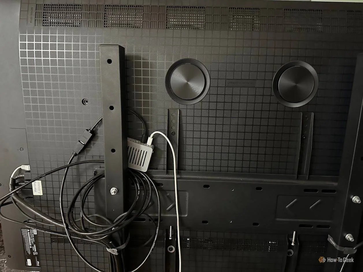 Raspberry Pi in a case, set up on the back of a TV.